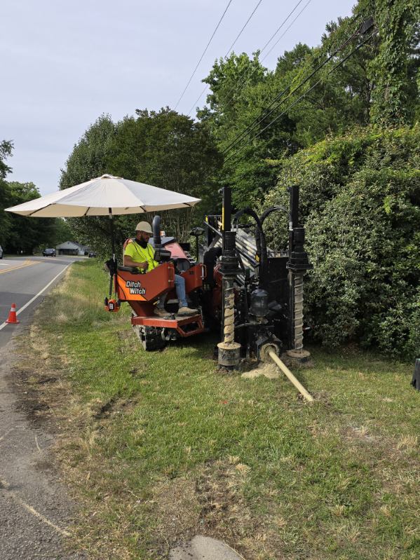 man on a machine drilling.